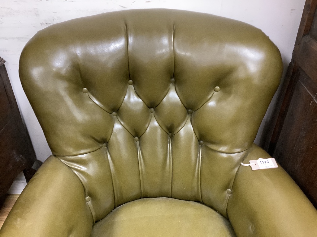 A Victorian buttoned library chair upholstered in olive green leatherette, width 70cm, depth 70cm, height 86cm